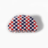 Red and Blue Checkerboard Hair Clip on a white background
