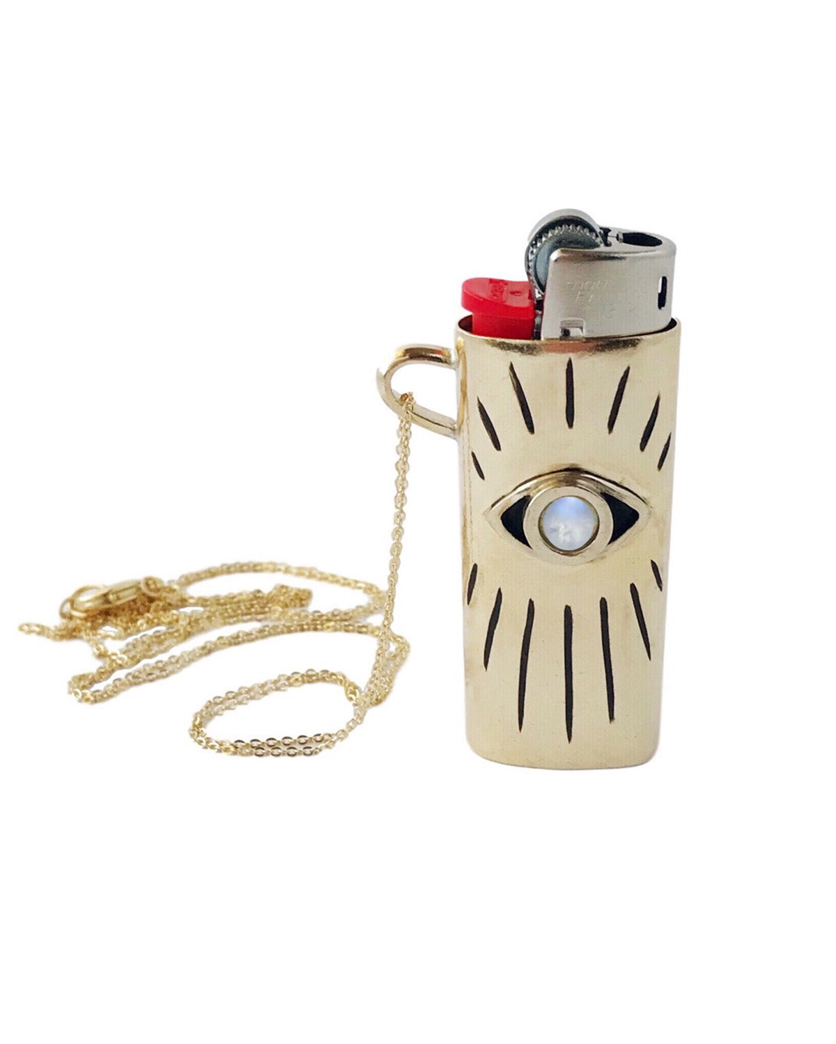 Gold lighter case with chain and eye design on a white background