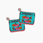 Pair of beaded earrings shaped like sardine tins with colorful fish illustration on a white background