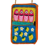Colorful beaded purse with fish and lemon design on a white background