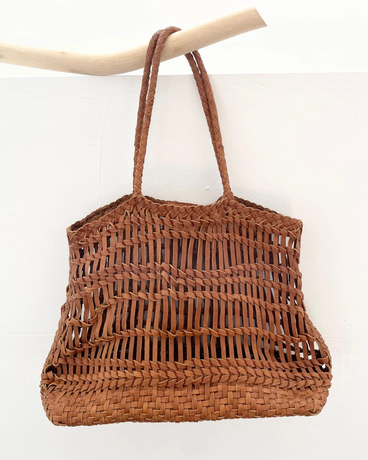 Leather woven bag on white background