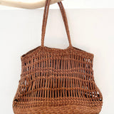 Leather woven bag on white background