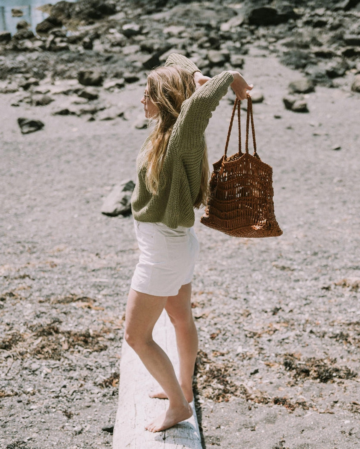 Girl holding Leather woven bag