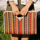 Model holding palm fiber woven red fiesta bag 