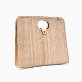 Palm fiber woven tan bag angled on a white background