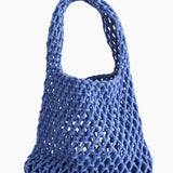 Blue mesh bag on a light background