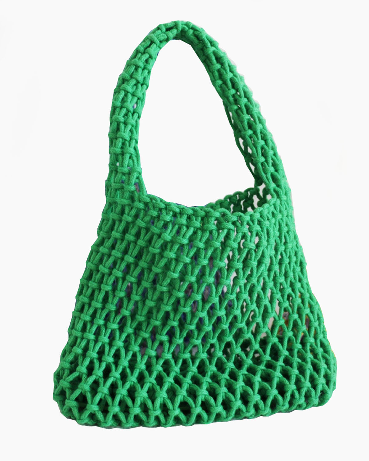 Green mesh bag on a light background