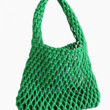 Green mesh bag on a light background