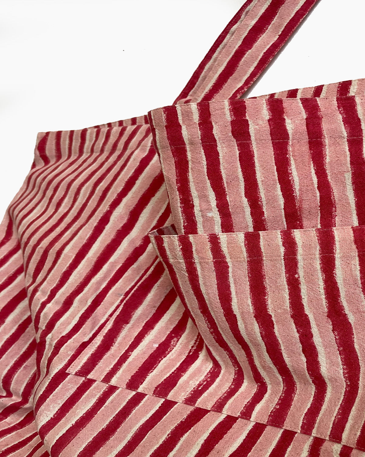 Red and white striped fabric on a white background