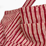 Red and white striped fabric on a white background