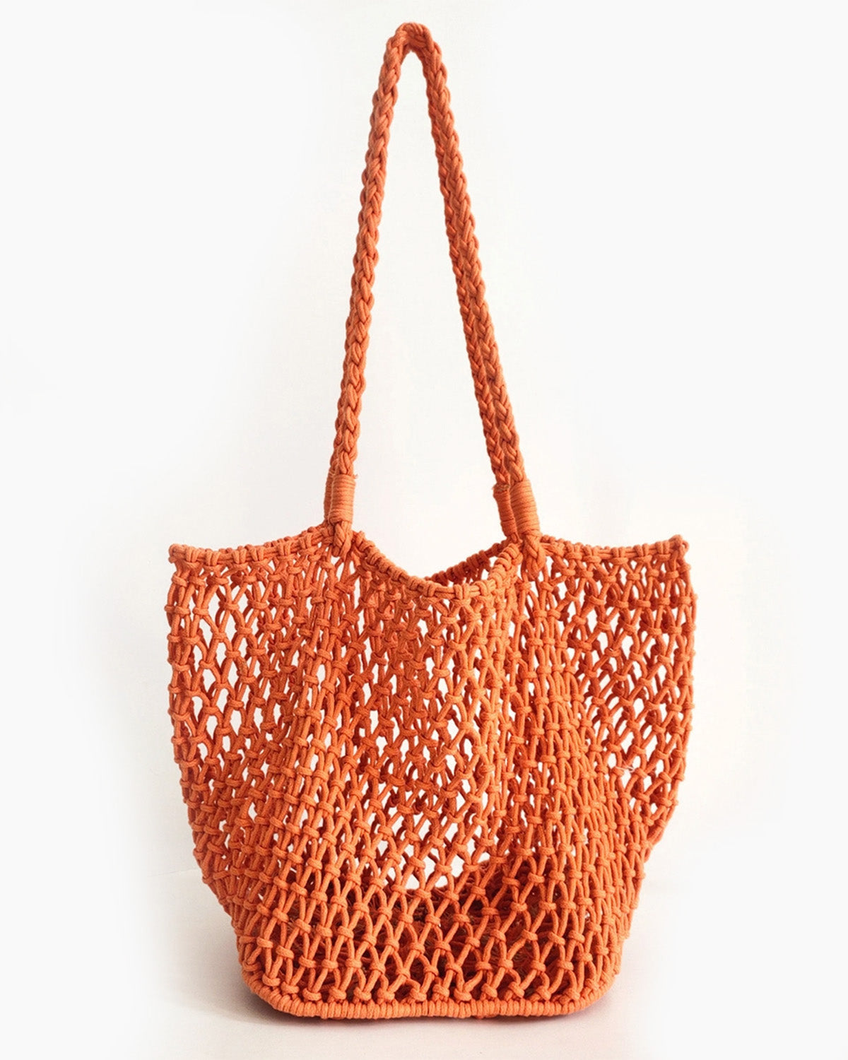 Orange woven tote bag on a white background