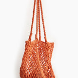 Orange woven bag on a white background