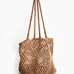 Brown woven bag with handles on a white background