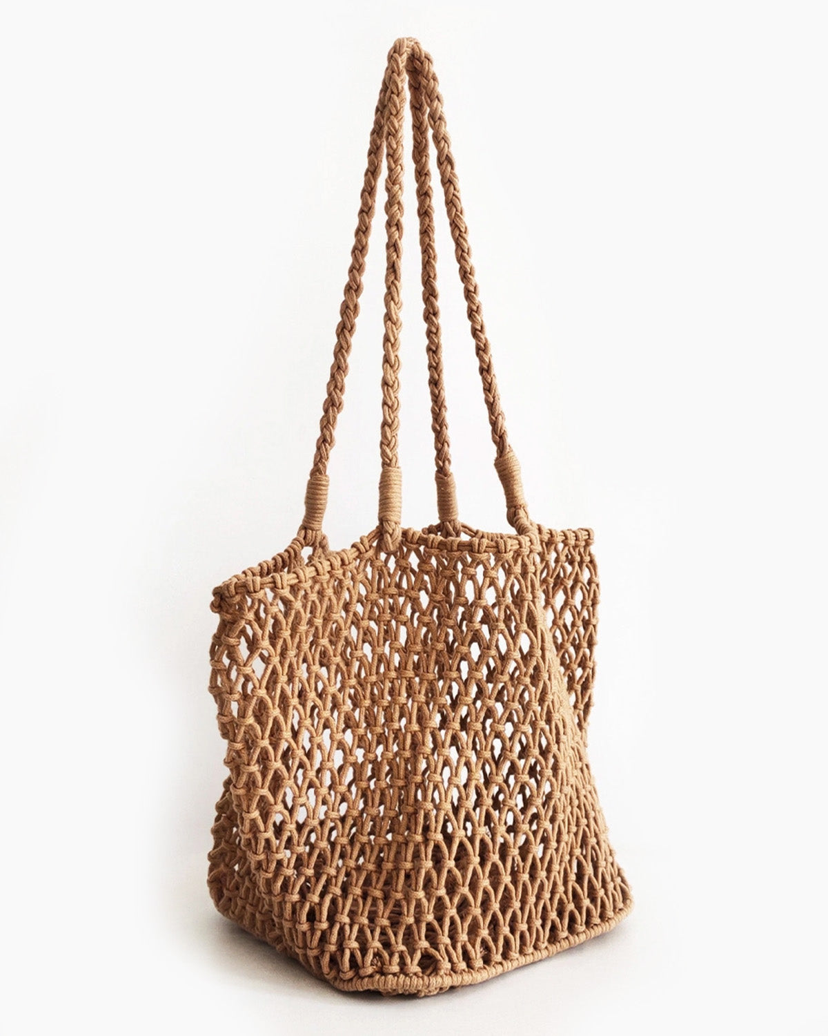 Brown woven bag with handles on a white background