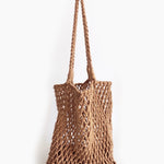 Brown woven bag on a white background