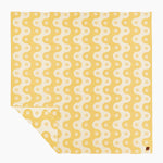 Yellow fabric with white pattern on a white background
