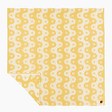 Yellow fabric with white pattern on a white background