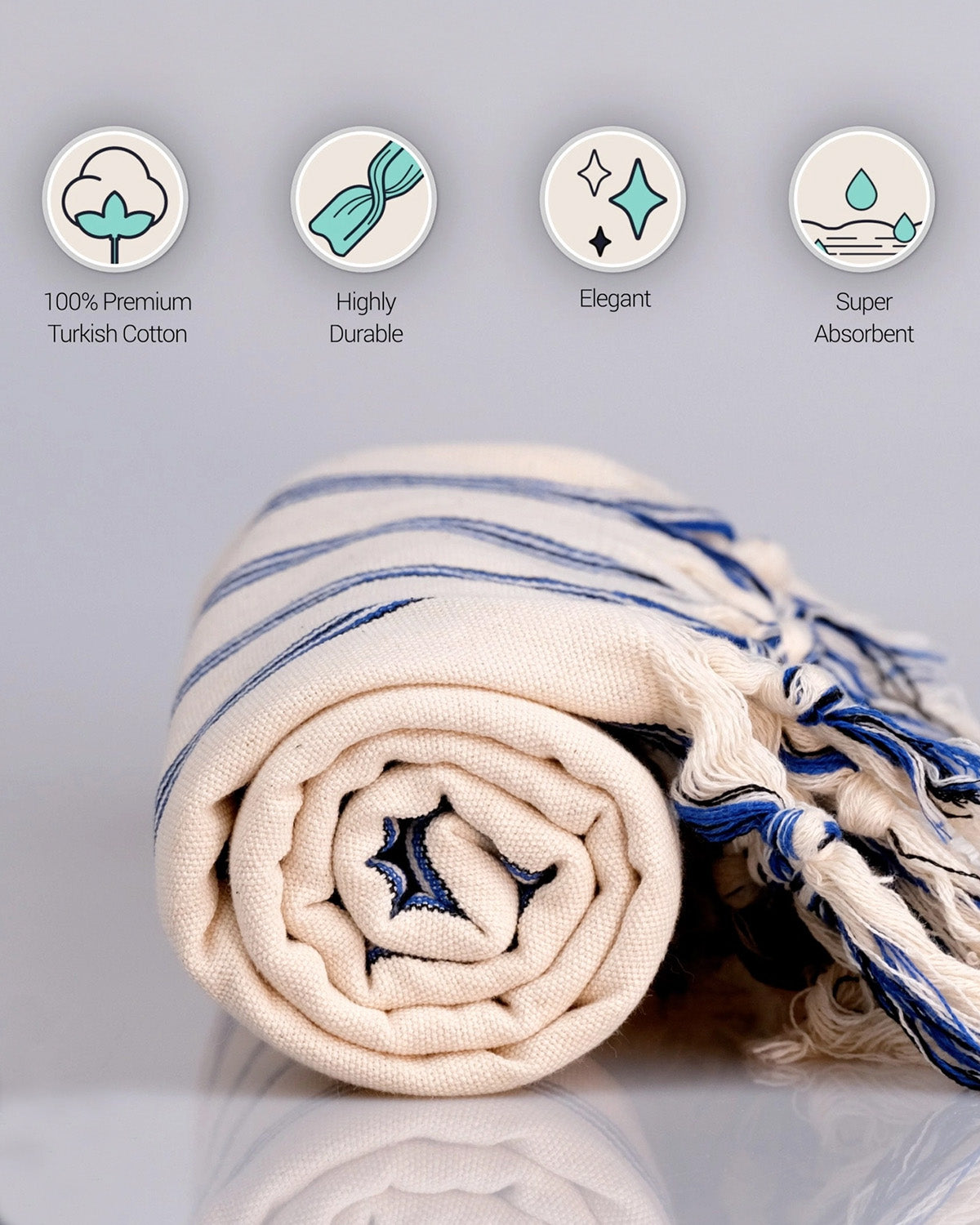 Rolled-up towel with blue stripes on a light gray background, featuring icons and text about product attributes
