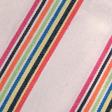 Close-up of fabric with multicolored stripes on a light background