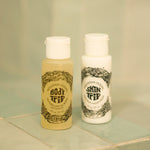 Two bottles of Mountain Ocean skincare products on a tiled surface