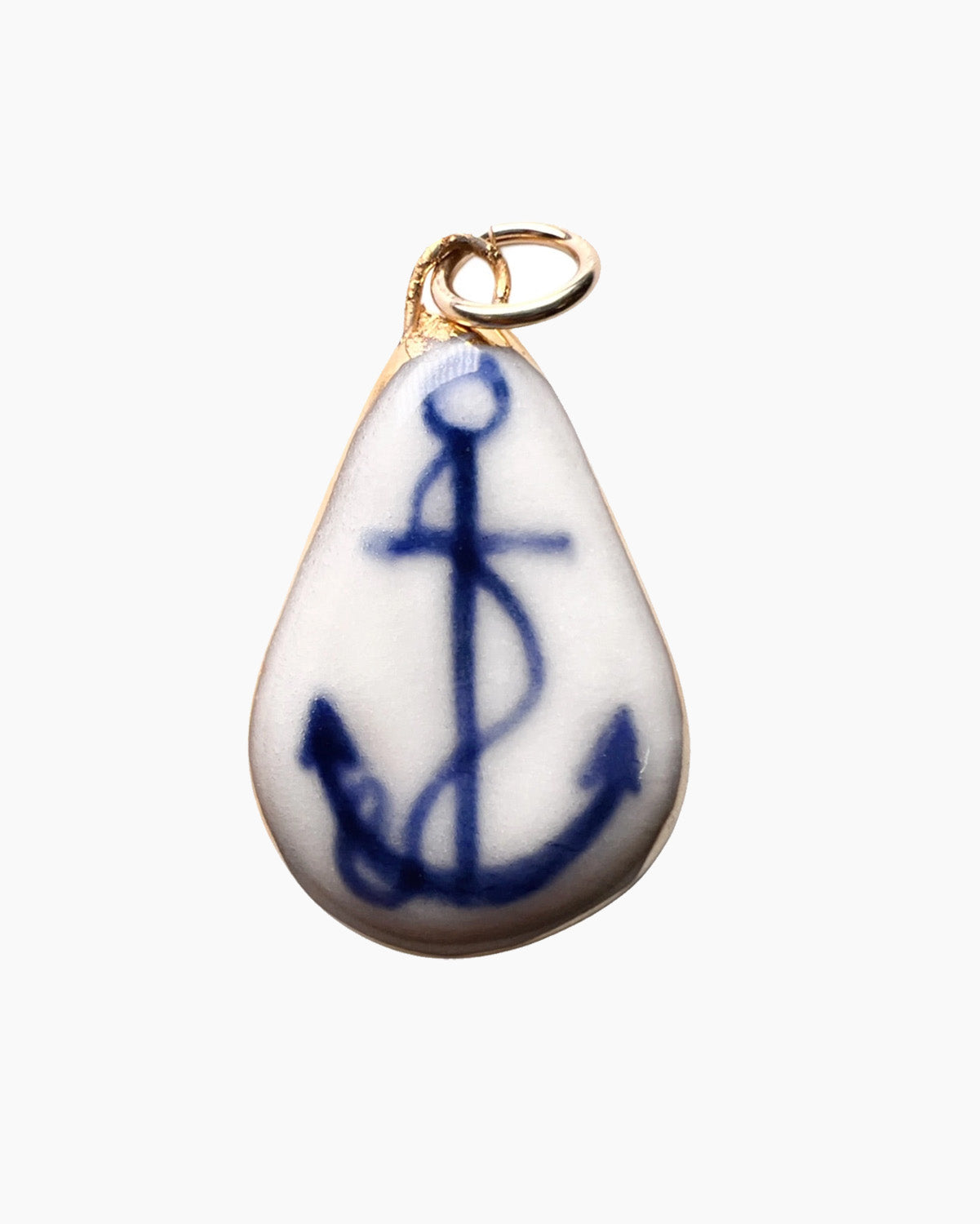 Teardrop-shaped porcelain pendant with blue anchor design on a white background