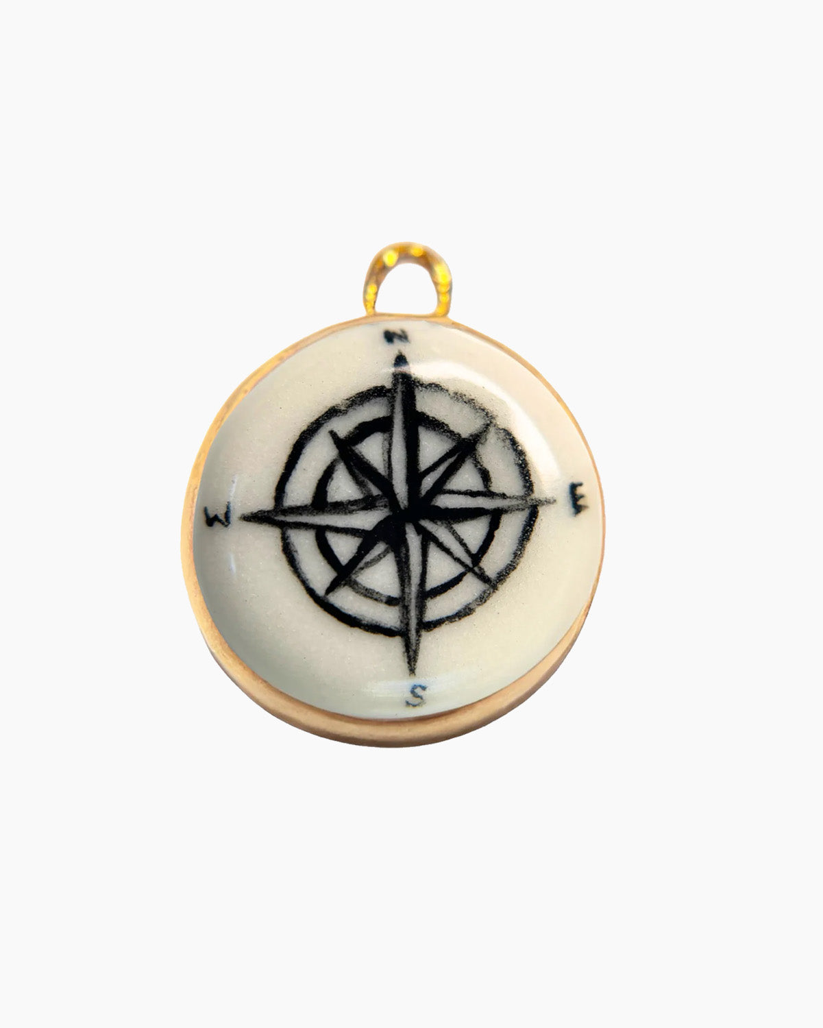 Pendant with compass design on a white background