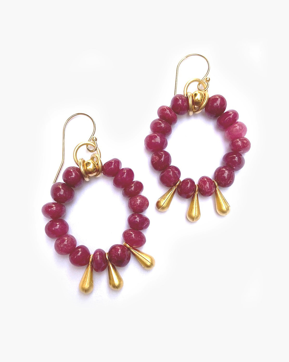 Pair of hoop earrings with pink beads and gold accents on a white background