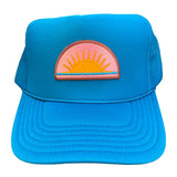 Blue cap with a colorful sun design on a white background