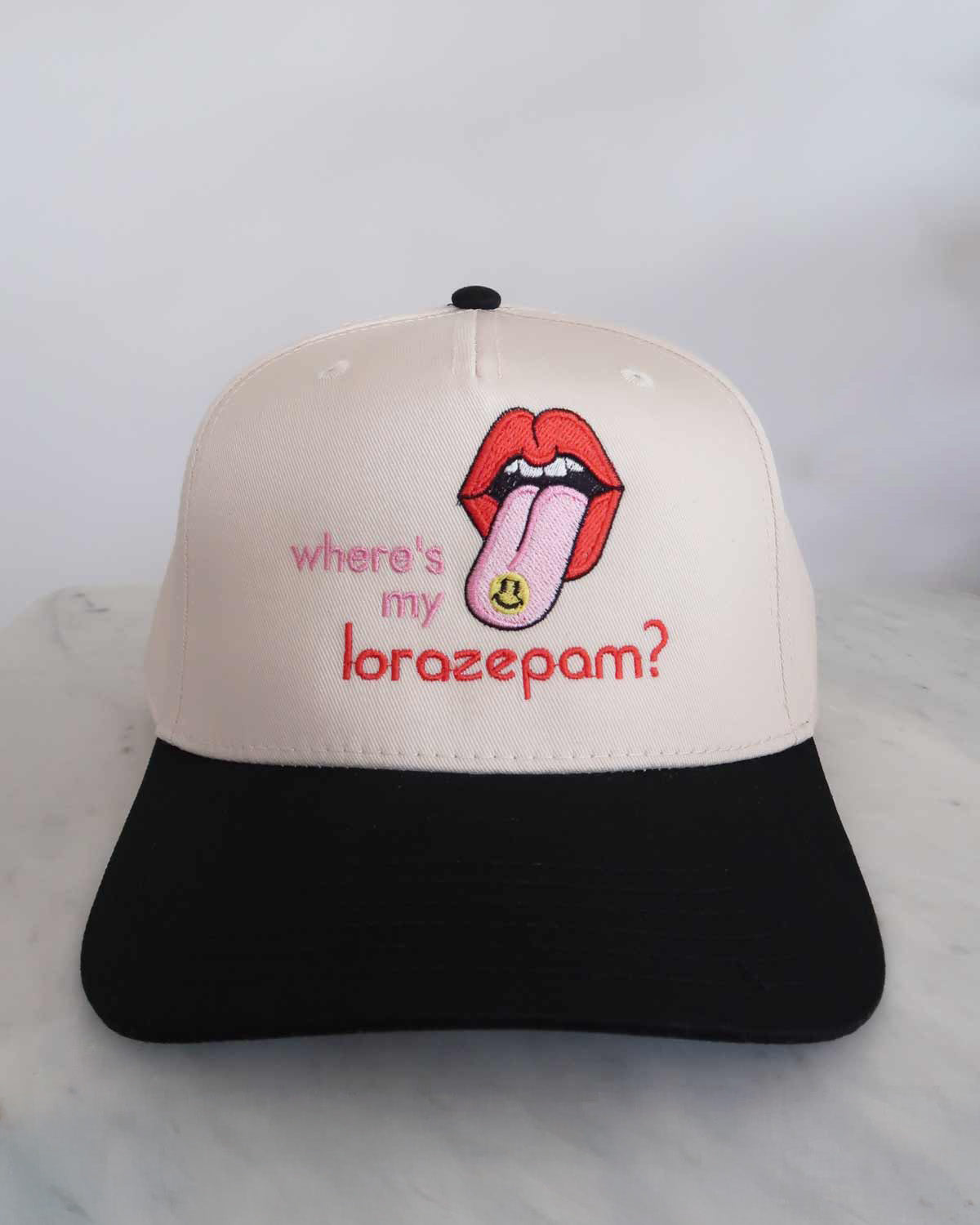 Cap with a graphic of lips and tongue, text 'where's my lorazepam?' on a white background