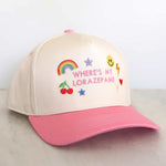 Beige and pink cap with colorful text and graphics on a light gray surface