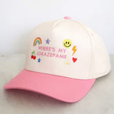 Pink and white cap with colorful text and graphics on a light gray background