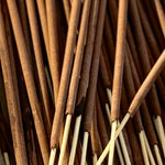 Close-up of incense sticks with a focus on texture and color