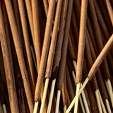 Close-up of incense sticks with a focus on texture and color