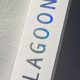 Product packaging with 'LAGOON' text in blue on a textured surface
