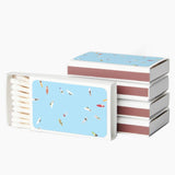Stack of books with a blue and pink cover design on a white background