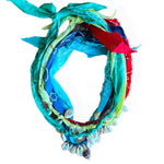Colorful woven wreath with star patterns on a white background