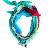 Colorful woven wreath with star patterns on a white background