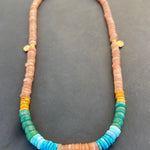 Necklace with multicolored beads on a dark background