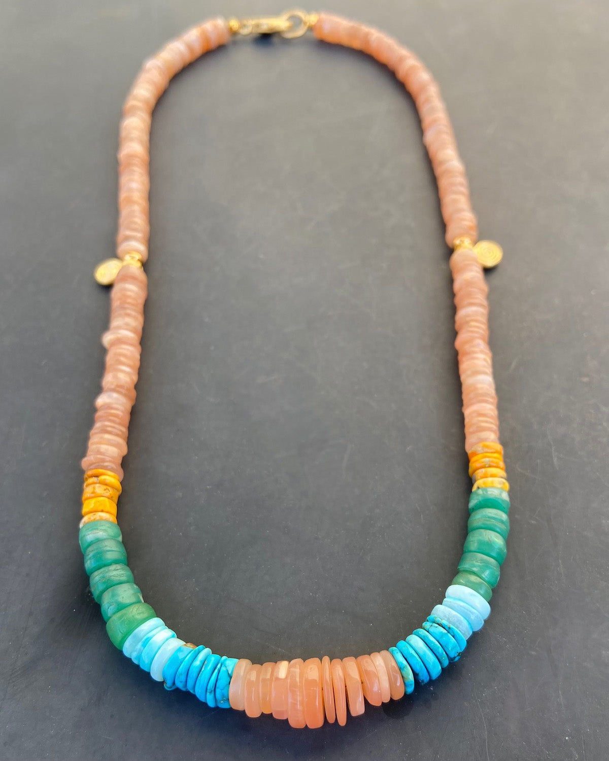 Necklace with multicolored beads on a dark background