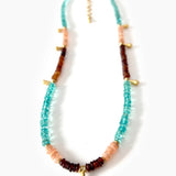 Necklace with multicolored beads on a white background