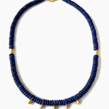 Blue beaded necklace with gold accents on a white background