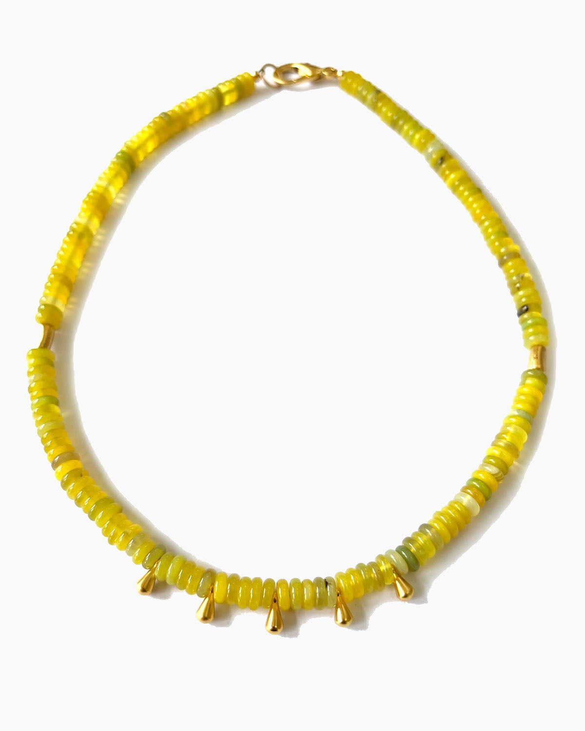 Yellow beaded necklace on a white background