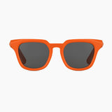 Orange sunglasses with dark lenses on a white background