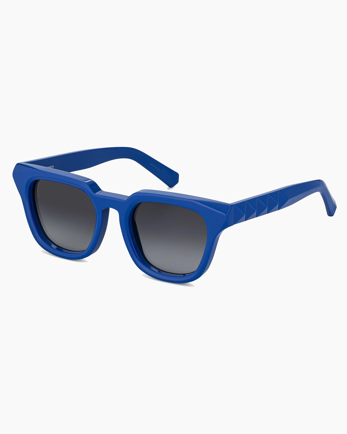Blue sunglasses with dark lenses on a white background