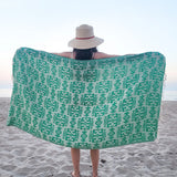 Girl holding green geometric Turkish towel