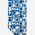 Blue and white patterned towel on a white background